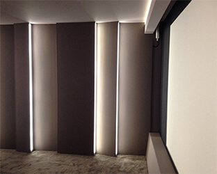 The LED lighting in the wall provides atmospheric light in the home cinema.