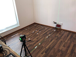 Outlining the absorber arrangement with painter’s tape on the floor